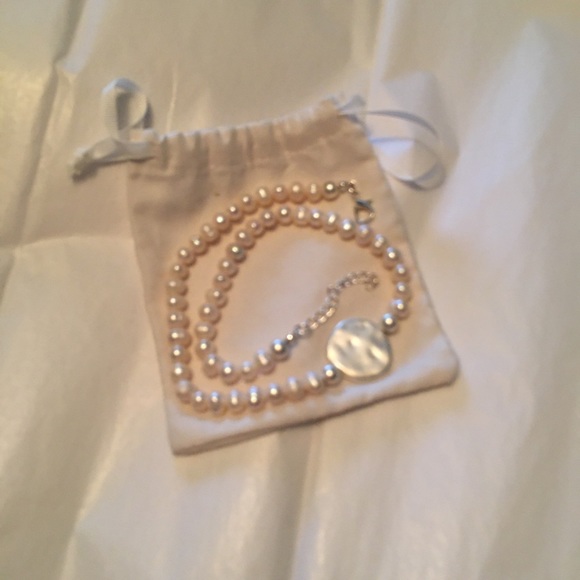 Faux pearl necklace with silvertone accent. - Picture 3 of 12